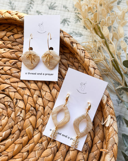 Gold Bows and Glitter Accent Shiny Clay Winter Earrings