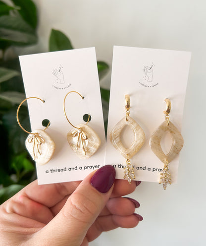 Gold Bows and Glitter Accent Shiny Clay Winter Earrings